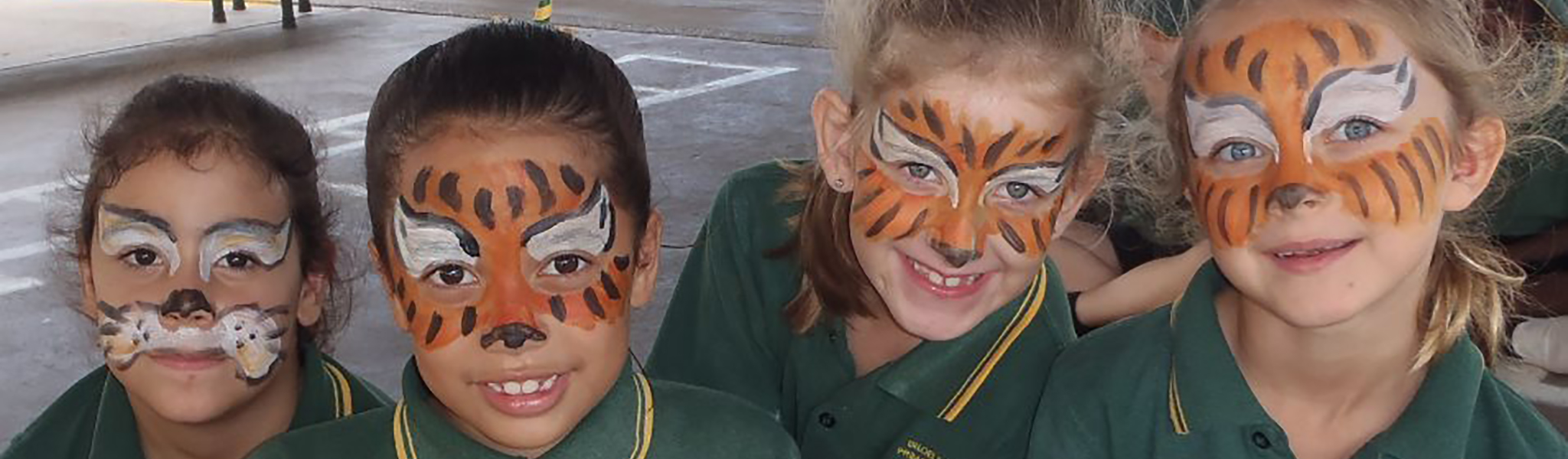 Four students with face paintings